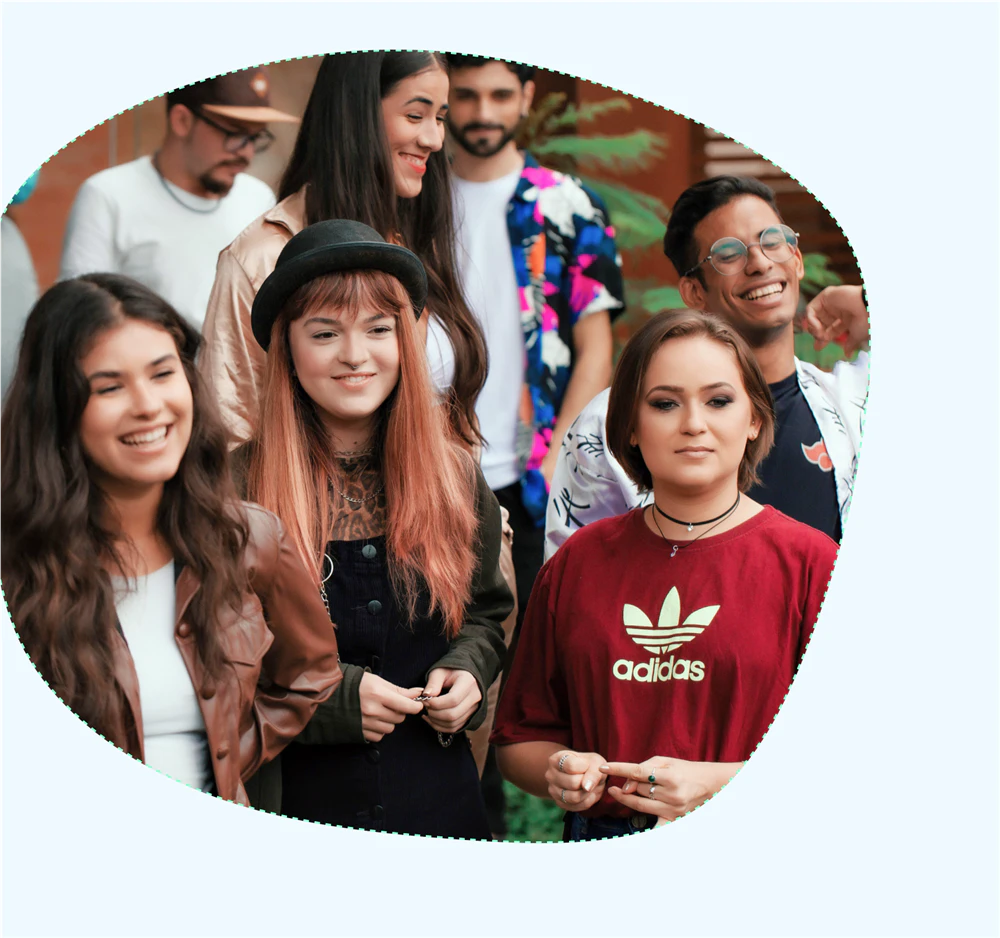A diverse group of young people smiling together outdoors